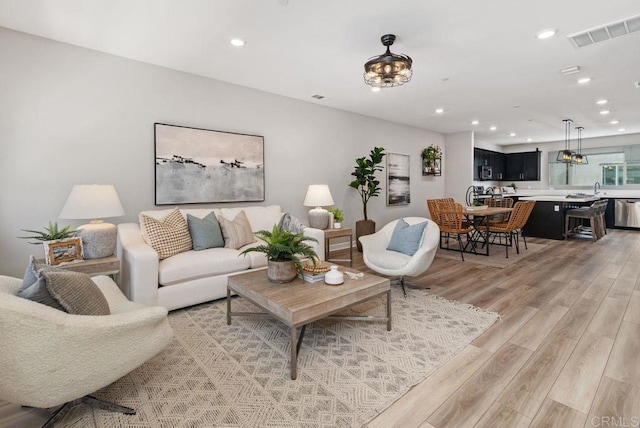 3510 Brody Way, Oceanside, CA 92056 - living area featuring light wood finished floors and recessed lighting