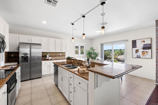 1412 Long View Dr, Chula Vista, CA 91915 - kitchen with black appliances, light tile patterned floors, tasteful backsplash, white cabinets, and recessed lighting