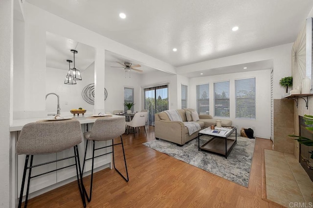 1802 Via Las Palmas Unit 36, National City, CA 91950 - living room with wood finished floors, ceiling fan, and recessed lighting