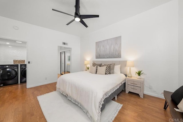 1802 Via Las Palmas Unit 36, National City, CA 91950 - bedroom featuring washing machine and dryer, wood finished floors, and a ceiling fan