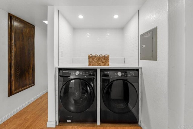 1802 Via Las Palmas Unit 36, National City, CA 91950 - laundry area with electric panel, washing machine and clothes dryer, light wood-type flooring, and recessed lighting