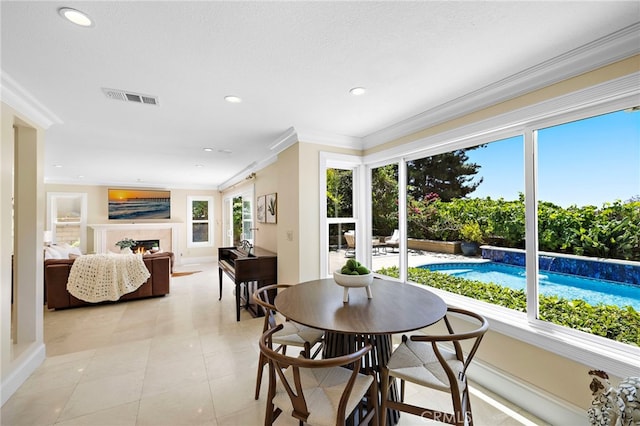 26582 Maside, Mission Viejo, CA 92692 - dining room with crown molding, a lit fireplace, and recessed lighting
