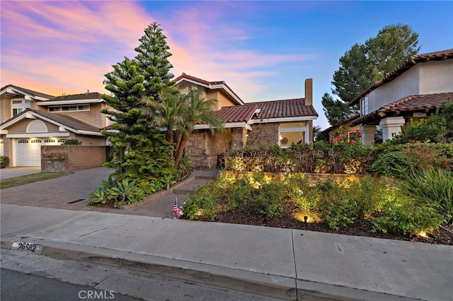 26582 Maside, Mission Viejo, CA 92692 - view of front of property with a tile roof, decorative driveway, a garage, a chimney, and stucco siding