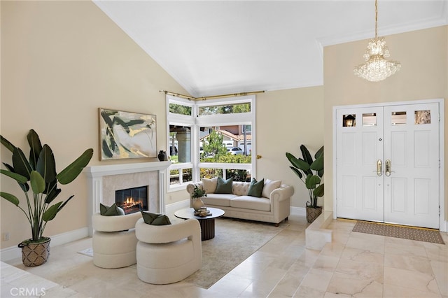 26582 Maside, Mission Viejo, CA 92692 - foyer entrance featuring a chandelier, a fireplace, crown molding, and high vaulted ceiling