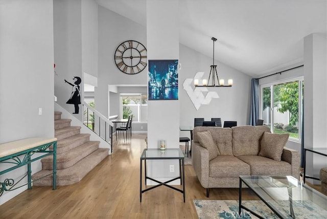 1380 Le Conte, Riverside, CA 92507 - living room with high vaulted ceiling, a chandelier, stairway, wood finished floors, and healthy amount of natural light