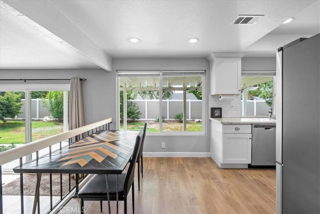 1380 Le Conte, Riverside, CA 92507 - dining room with light wood-style flooring, a textured ceiling, and recessed lighting