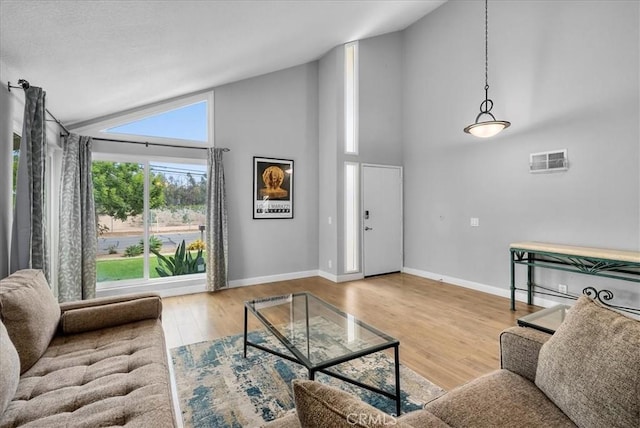1380 Le Conte, Riverside, CA 92507 - living room with high vaulted ceiling and wood finished floors