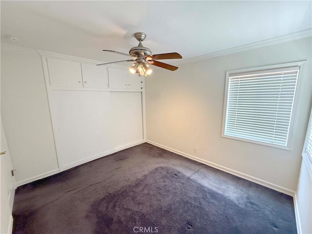 21045 Hemmingway St, Canoga Park, CA 91304 - empty room with a ceiling fan, dark carpet, and ornamental molding