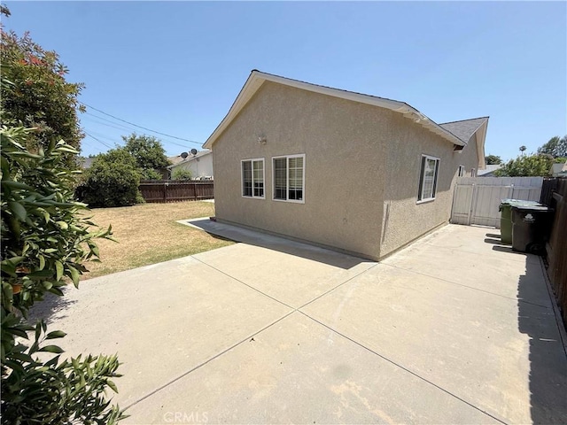21045 Hemmingway St, Canoga Park, CA 91304 - back of house featuring stucco siding and a patio