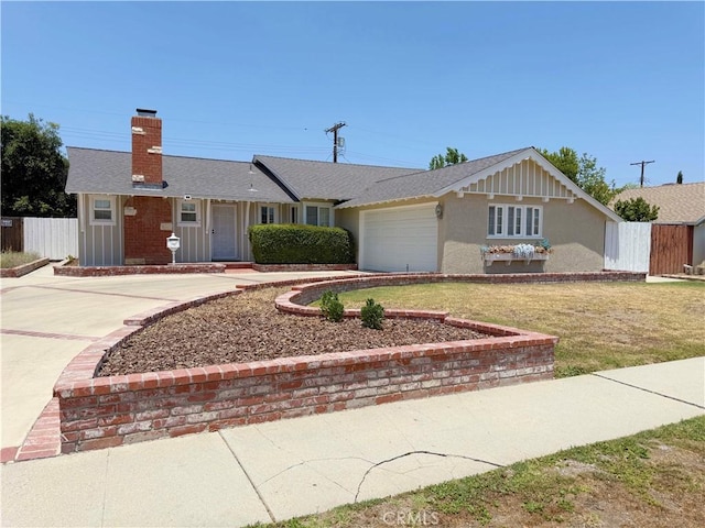 21045 Hemmingway St, Canoga Park, CA 91304 - ranch-style house featuring a chimney, an attached garage, concrete driveway, stucco siding, and a front lawn
