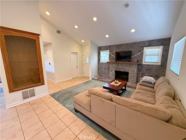 21045 Hemmingway St, Canoga Park, CA 91304 - living area with light tile patterned floors, recessed lighting, lofted ceiling, and a stone fireplace