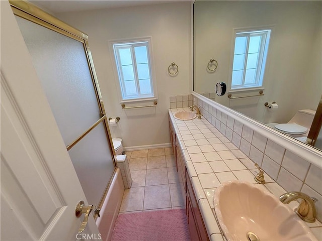 21045 Hemmingway St, Canoga Park, CA 91304 - full bathroom with a shower with door, double vanity, and tile patterned flooring