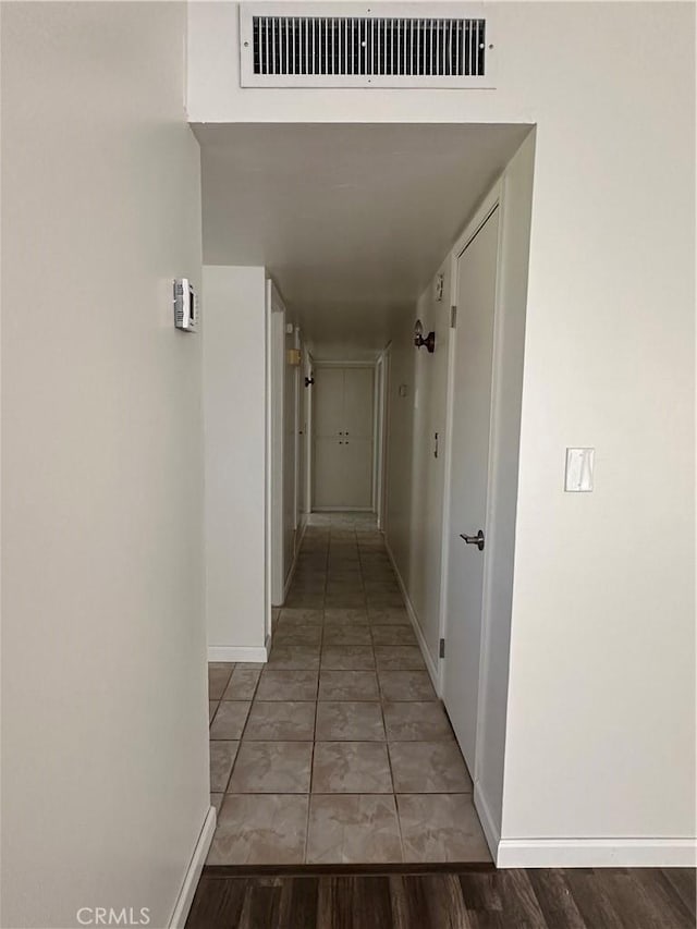 1624 Forane St, Barstow, CA 92311 - hallway featuring baseboards and light tile patterned floors