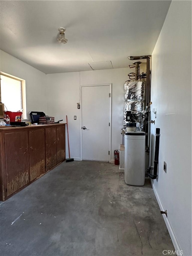 1624 Forane St, Barstow, CA 92311 - garage with baseboards and a desk