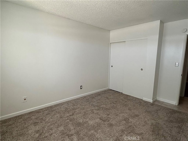 1624 Forane St, Barstow, CA 92311 - unfurnished bedroom with carpet, a closet, and a textured ceiling