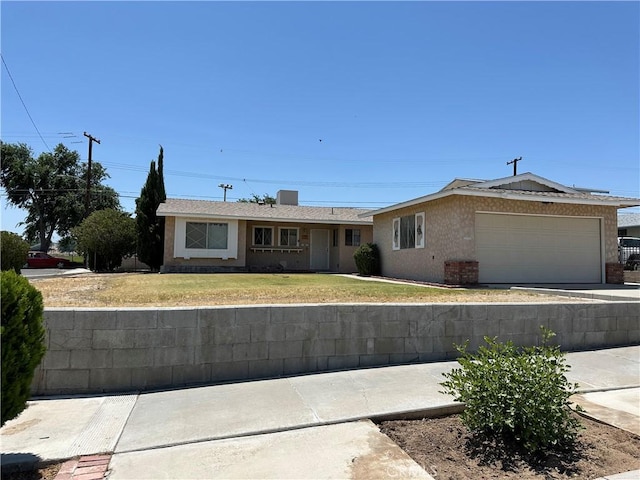 1624 Forane St, Barstow, CA 92311 - single story home with an attached garage, a front lawn, and driveway