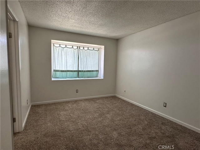 1624 Forane St, Barstow, CA 92311 - carpeted spare room featuring a textured ceiling and baseboards