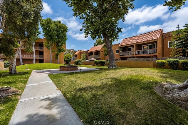 6600 Warner Ave Unit 121, Huntington Beach, CA 92647 - view of community featuring a lawn and a residential view