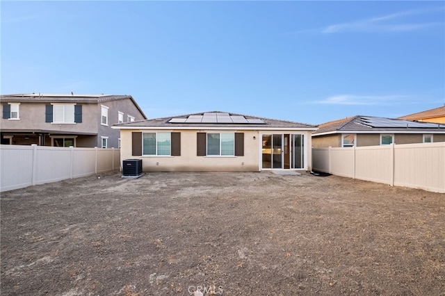 431 Daniella Way, Perris, CA 92570 - rear view of house featuring roof mounted solar panels, a fenced backyard, and stucco siding