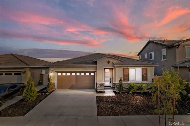 431 Daniella Way, Perris, CA 92570 - single story home with a garage, concrete driveway, stucco siding, stone siding, and a tiled roof