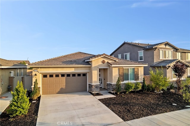 431 Daniella Way, Perris, CA 92570 - single story home with an attached garage, concrete driveway, stucco siding, stone siding, and a tile roof