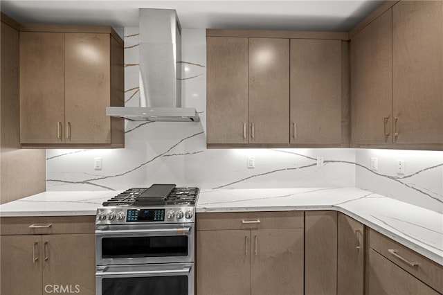 431 Daniella Way, Perris, CA 92570 - kitchen featuring wall chimney exhaust hood, double oven range, decorative backsplash, and light stone countertops