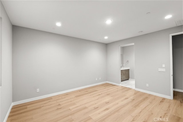431 Daniella Way, Perris, CA 92570 - unfurnished bedroom with light wood-style floors, recessed lighting, and ensuite bathroom