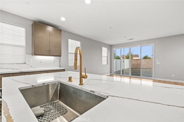 431 Daniella Way, Perris, CA 92570 - kitchen with recessed lighting, light stone counters, and open floor plan