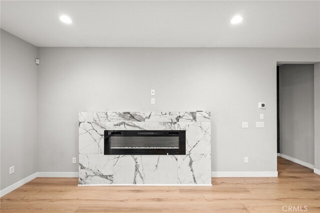 431 Daniella Way, Perris, CA 92570 - detailed view of wood finished floors, a high end fireplace, and recessed lighting