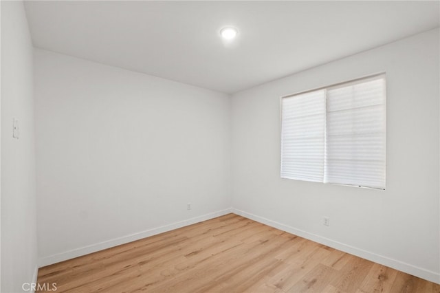 431 Daniella Way, Perris, CA 92570 - unfurnished room with baseboards and wood finished floors