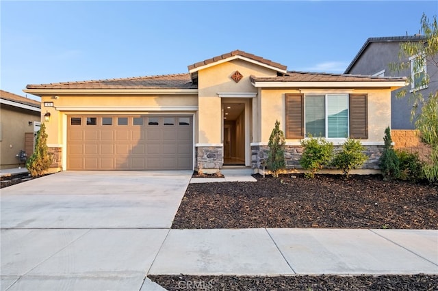 431 Daniella Way, Perris, CA 92570 - view of front of house featuring stone siding, a garage, driveway, stucco siding, and a tile roof