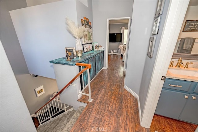 22943 Banyan Pl Unit 306, Saugus, CA 91390 - hall featuring dark wood-style floors and stairs