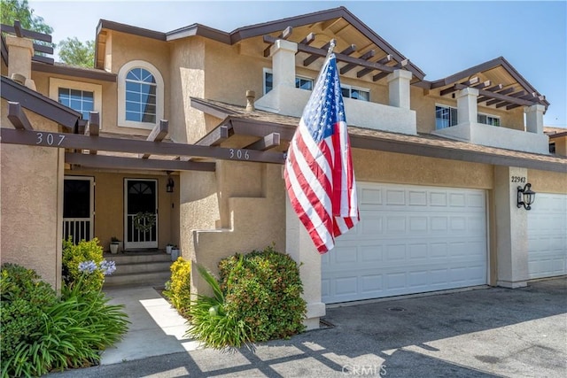 22943 Banyan Pl Unit 306, Saugus, CA 91390 - multi unit property with stucco siding and a garage