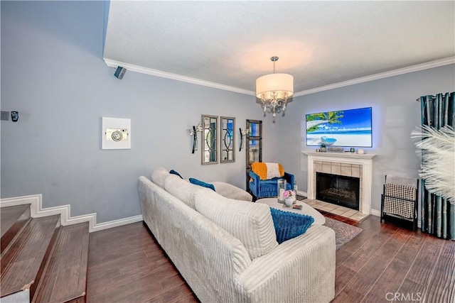 22943 Banyan Pl Unit 306, Saugus, CA 91390 - living room with ornamental molding, a fireplace, wood finished floors, and a chandelier