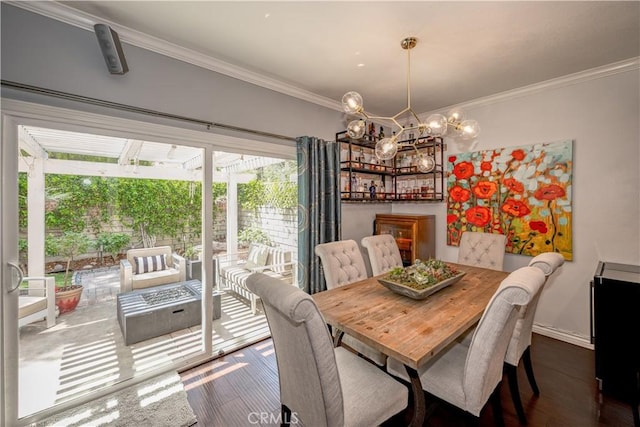 22943 Banyan Pl Unit 306, Saugus, CA 91390 - dining area with crown molding, wood finished floors, and a chandelier