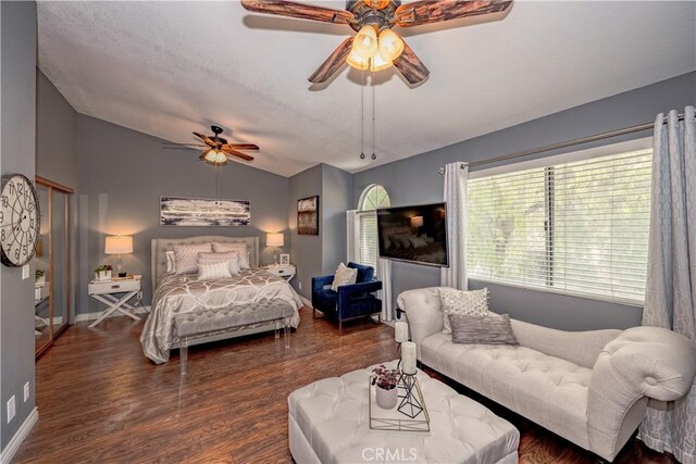 22943 Banyan Pl Unit 306, Saugus, CA 91390 - bedroom with vaulted ceiling, wood finished floors, and a ceiling fan