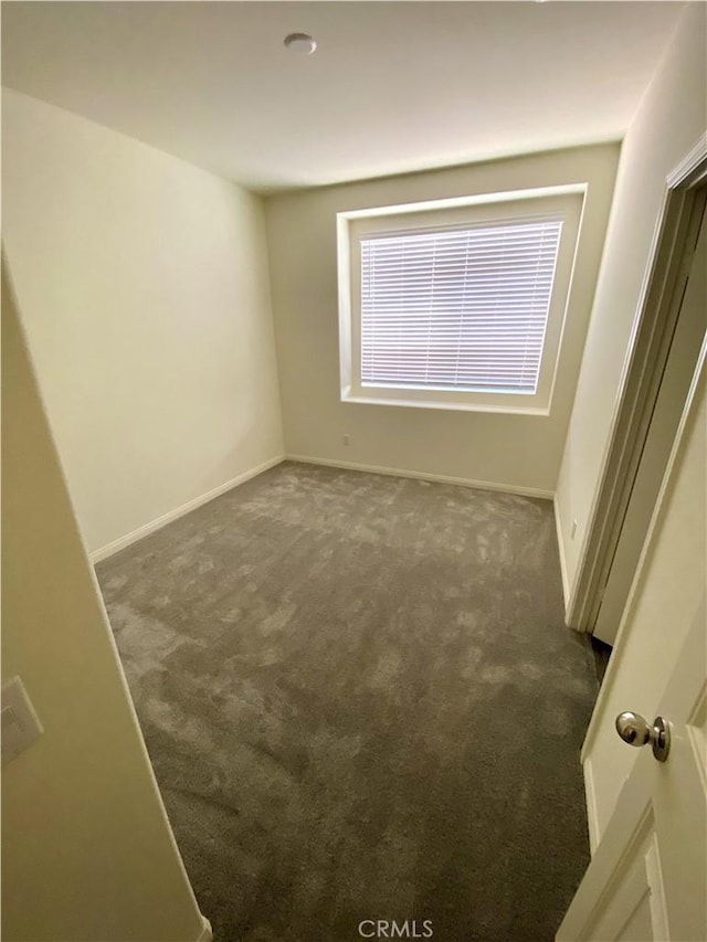 16620 Wyndham Ln Unit 11, Fontana, CA 92336 - carpeted empty room with baseboards