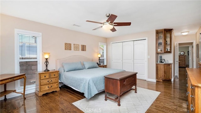 5215 E Monlaco Rd, Long Beach, CA 90808 - bedroom featuring a closet, dark wood-style floors, and a ceiling fan