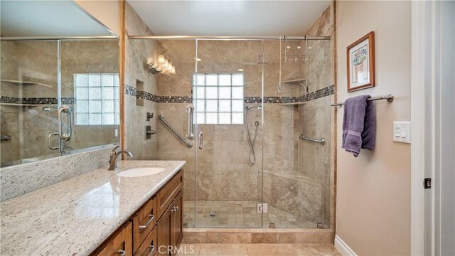 5215 E Monlaco Rd, Long Beach, CA 90808 - bathroom featuring vanity, a stall shower, and tile patterned flooring