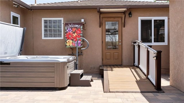 5215 E Monlaco Rd, Long Beach, CA 90808 - property entrance with a hot tub and stucco siding