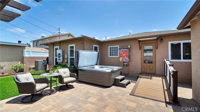 5215 E Monlaco Rd, Long Beach, CA 90808 - view of patio / terrace with a hot tub