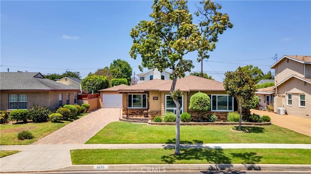 5215 E Monlaco Rd, Long Beach, CA 90808 - view of front of property with a front lawn and a detached garage
