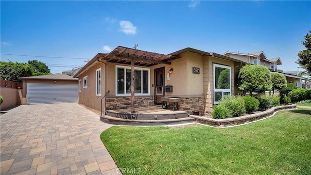 5215 E Monlaco Rd, Long Beach, CA 90808 - view of front facade featuring stone siding, a pergola, a front yard, stucco siding, and an outbuilding