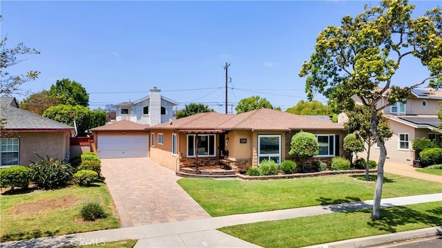 5215 E Monlaco Rd, Long Beach, CA 90808 - ranch-style house featuring an outbuilding, stucco siding, a front lawn, stone siding, and a detached garage