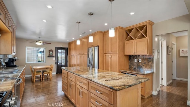 5215 E Monlaco Rd, Long Beach, CA 90808 - kitchen featuring stainless steel appliances, a center island, decorative backsplash, dark wood-style flooring, and recessed lighting