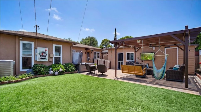 5215 E Monlaco Rd, Long Beach, CA 90808 - rear view of property featuring stucco siding, a lawn, a patio area, and an outdoor living space