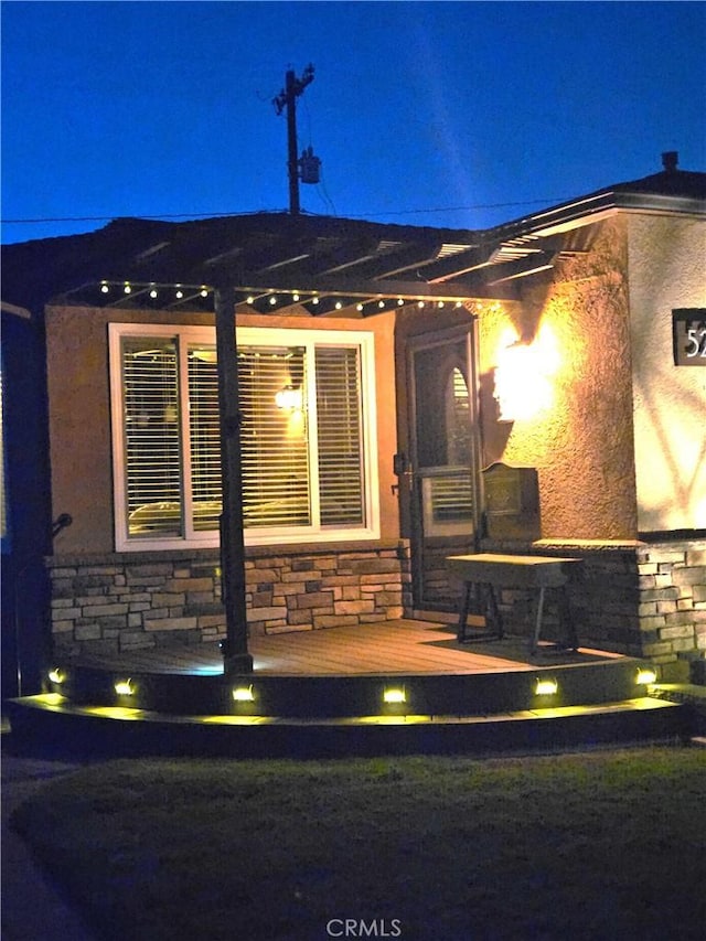 5215 E Monlaco Rd, Long Beach, CA 90808 - view of exterior entry with stone siding and stucco siding