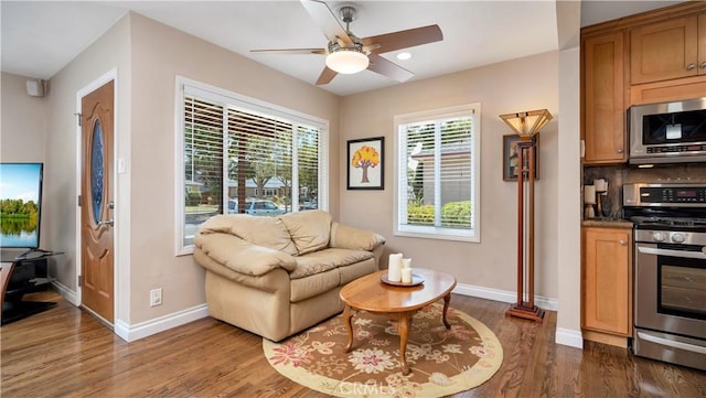 5215 E Monlaco Rd, Long Beach, CA 90808 - living area featuring dark wood-style floors, a ceiling fan, and recessed lighting