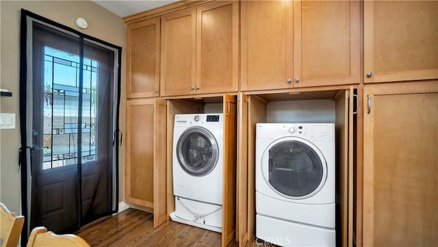 5215 E Monlaco Rd, Long Beach, CA 90808 - washroom featuring wood finished floors, washing machine and dryer, and cabinet space