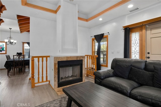 6739 Palm Ave, Riverside, CA 92506 - living room with light wood-style floors, a chandelier, a fireplace, and recessed lighting
